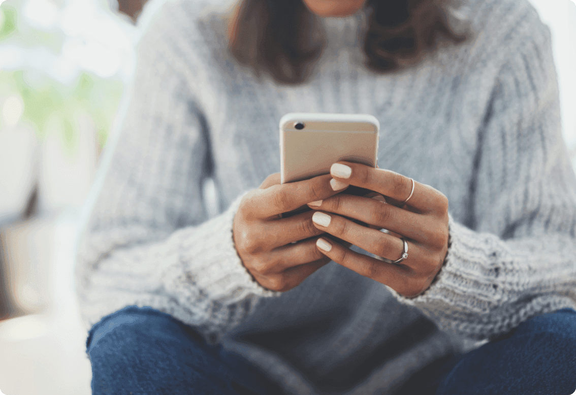 A woman holding a smartphone