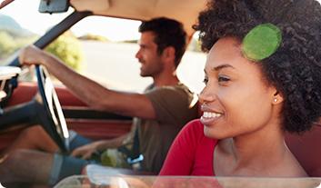 a woman and a man in a car