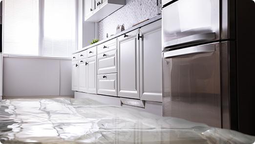 a kitchen with white cabinets