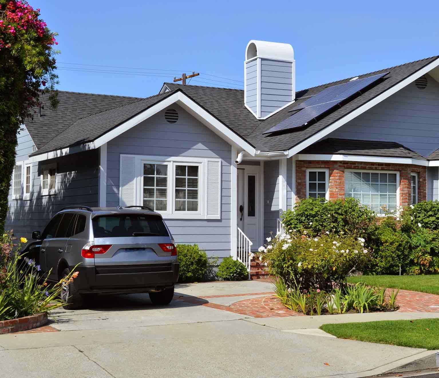 a car parked in front of a house