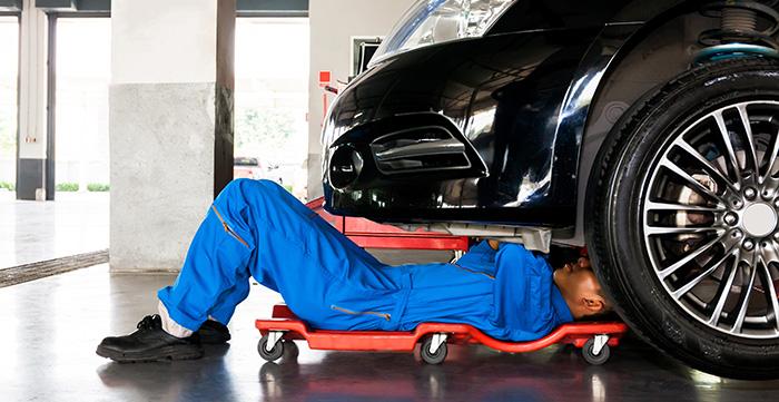 a person lying on a car